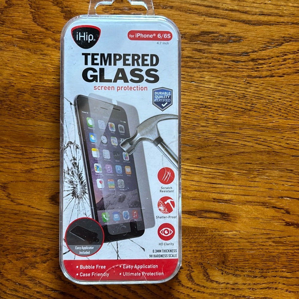 NWT. (New with tape intact). Never opened. Tempered glass iPhone 6/6s